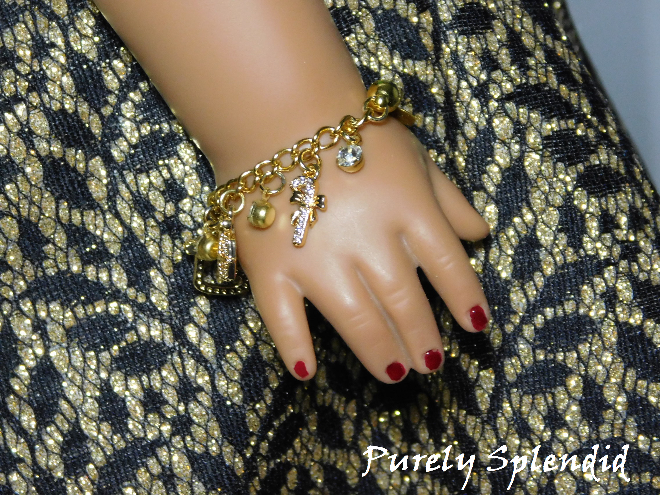 Candy Cane Cubic Zirconia Charm on a gold charm bracelet for 18 inch dolls