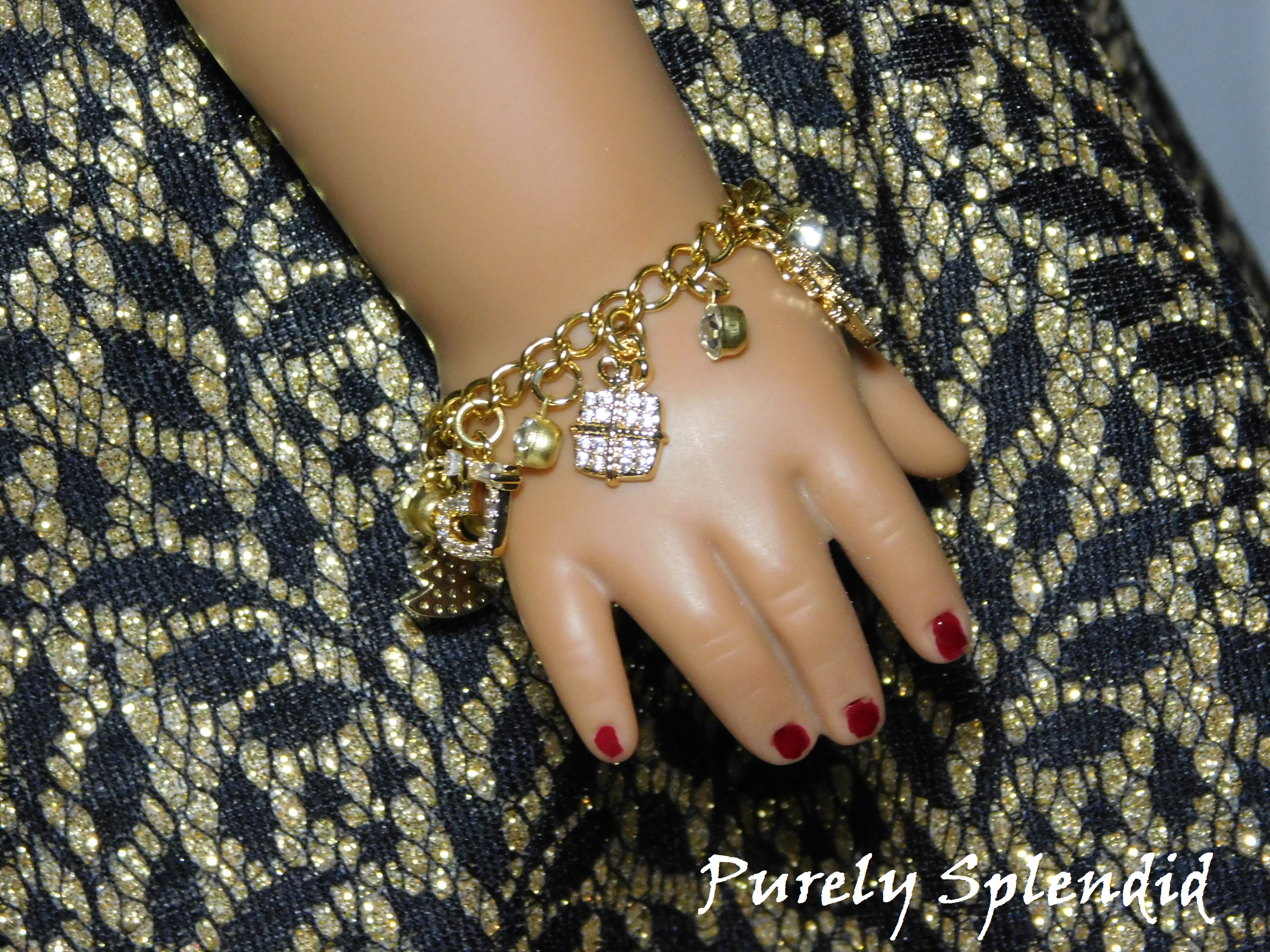 Cubic Zirconia Gift Charm on a gold charm bracelet for 18 inch dolls
