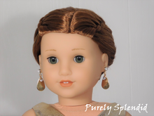 Load image into Gallery viewer, 18 inch doll shown wearing a pair of Golden Drop Earrings and Super Sparkling Crystal Studs
