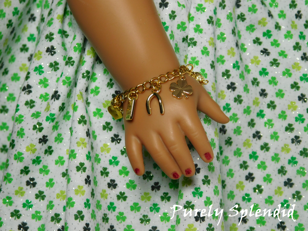 gold charms -wishbone, shamrock, genie lamp on a gold bracelet for 18 inch dolls
