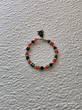 Halloween sparkle bracelet with black skull and crossbones charm for 18 inch girl dolls, American made | Purely Splendid