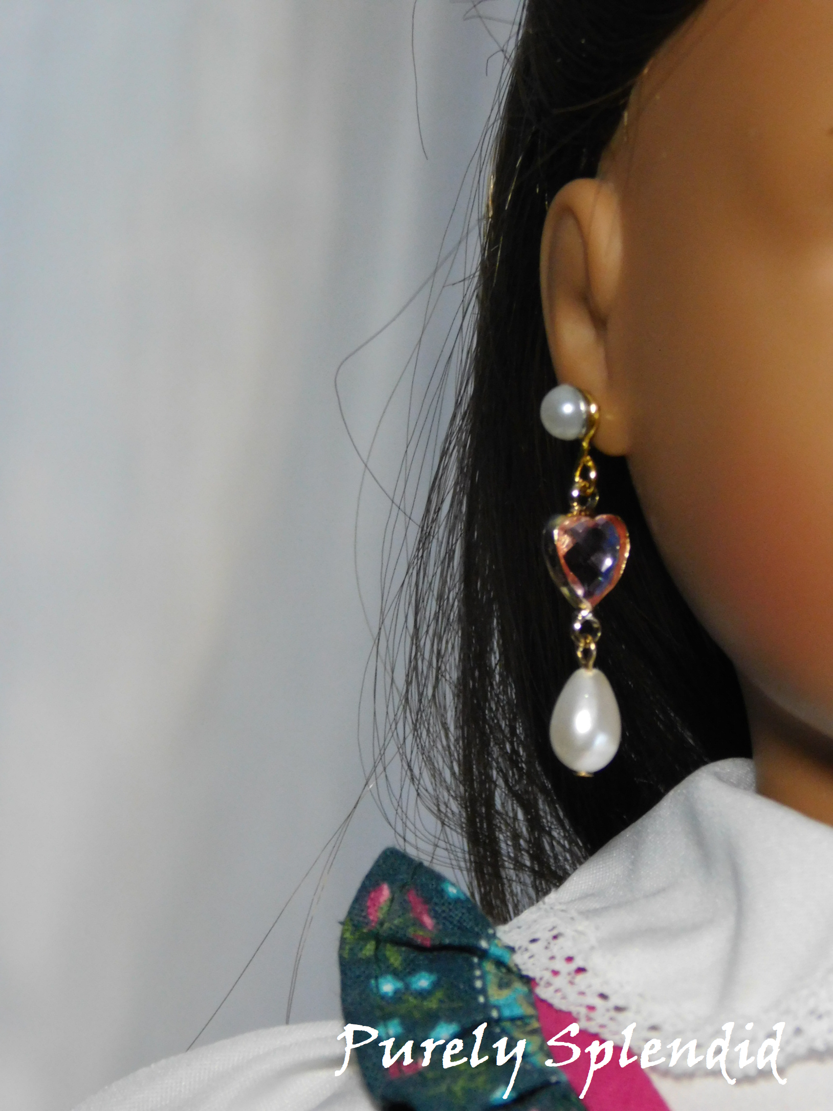 18 inch doll wearing pink hearts and pearls earring dangles with pearl studs
