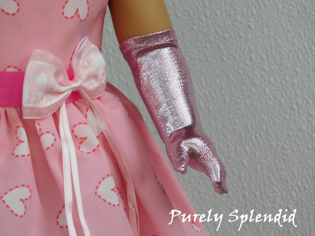 Icy Pink Gloves shown on the left hand of an 18 inch doll
