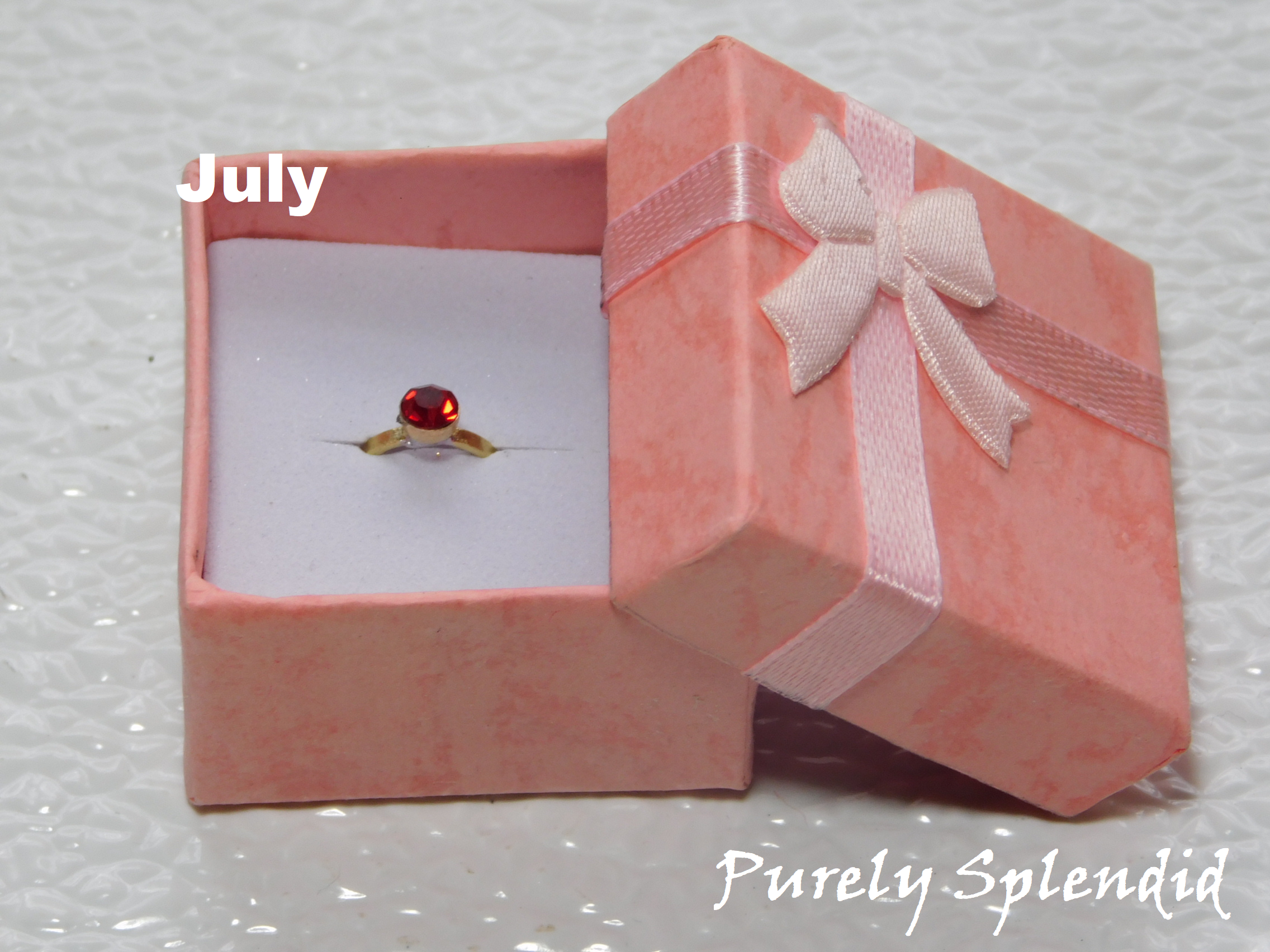 July Birthstone Ring for 18 inch dolls - Ruby colored crystal on a gold band