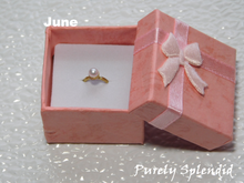 Load image into Gallery viewer, June Birthstone Ring for 18 inch dolls - pearl like bead on a gold band
