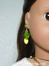 Load image into Gallery viewer, 18 inch doll wearing a pair of Lemon Earrings with 2mm studs
