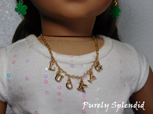 Load image into Gallery viewer, gold charm necklace with the word lucky spelled out and a four leaf clover charm
