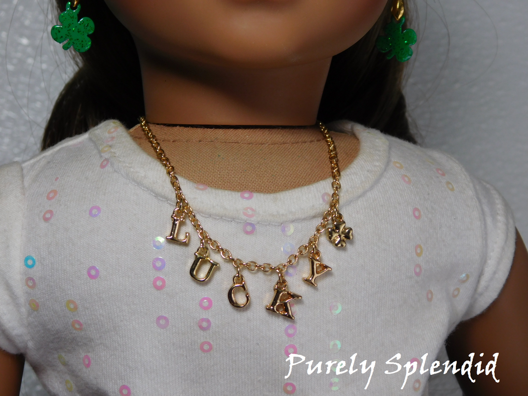 gold charm necklace with the word lucky spelled out and a four leaf clover charm