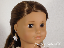 Load image into Gallery viewer, 18 inch doll shown wearing a pair of Milk Glass Earrings which consist of vintage milk glass drops hung in a cluster
