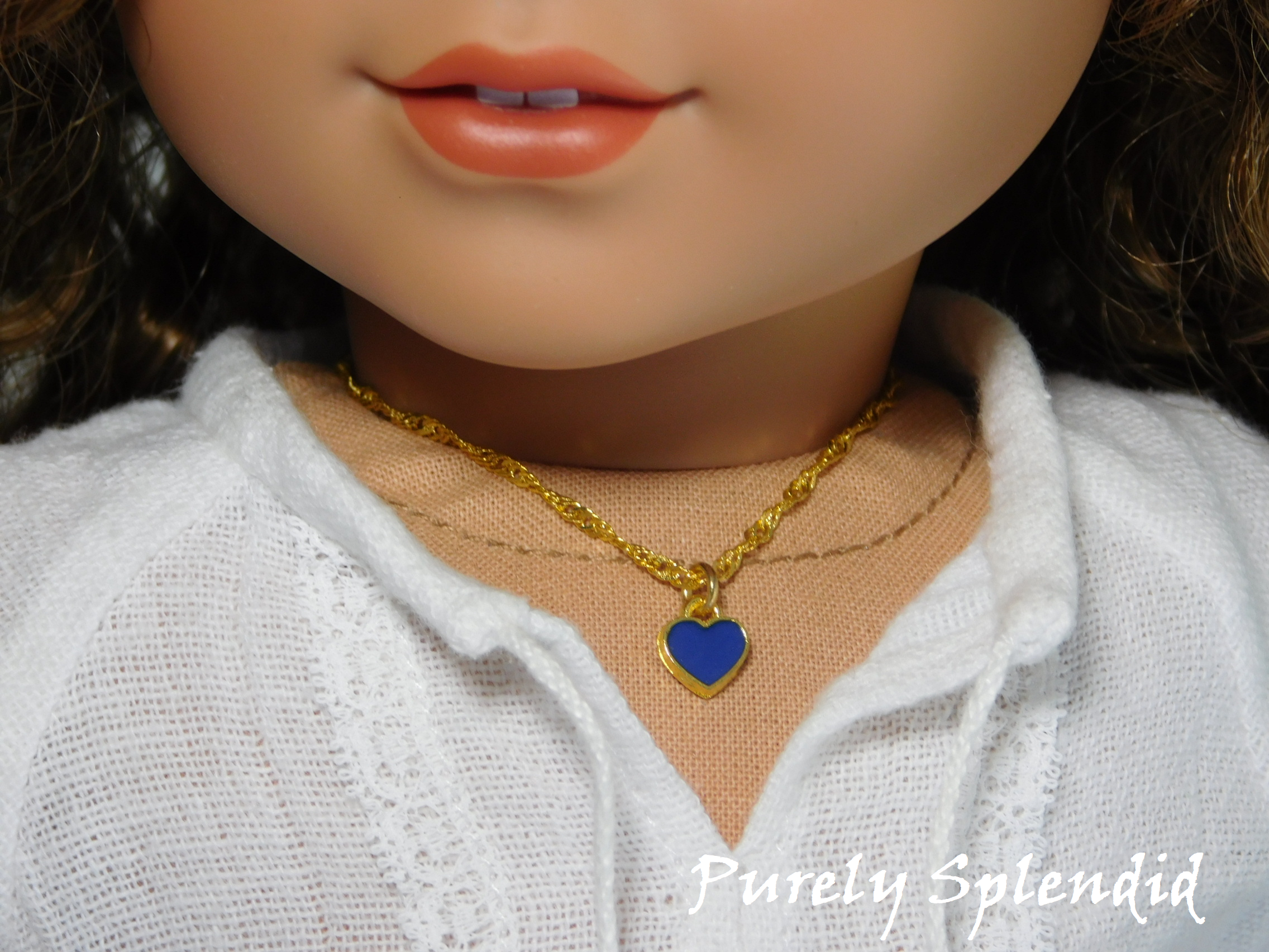 18 inch doll shown wearing a Blue Mini Heart Choker necklace - small blue heart on a twisted gold chain