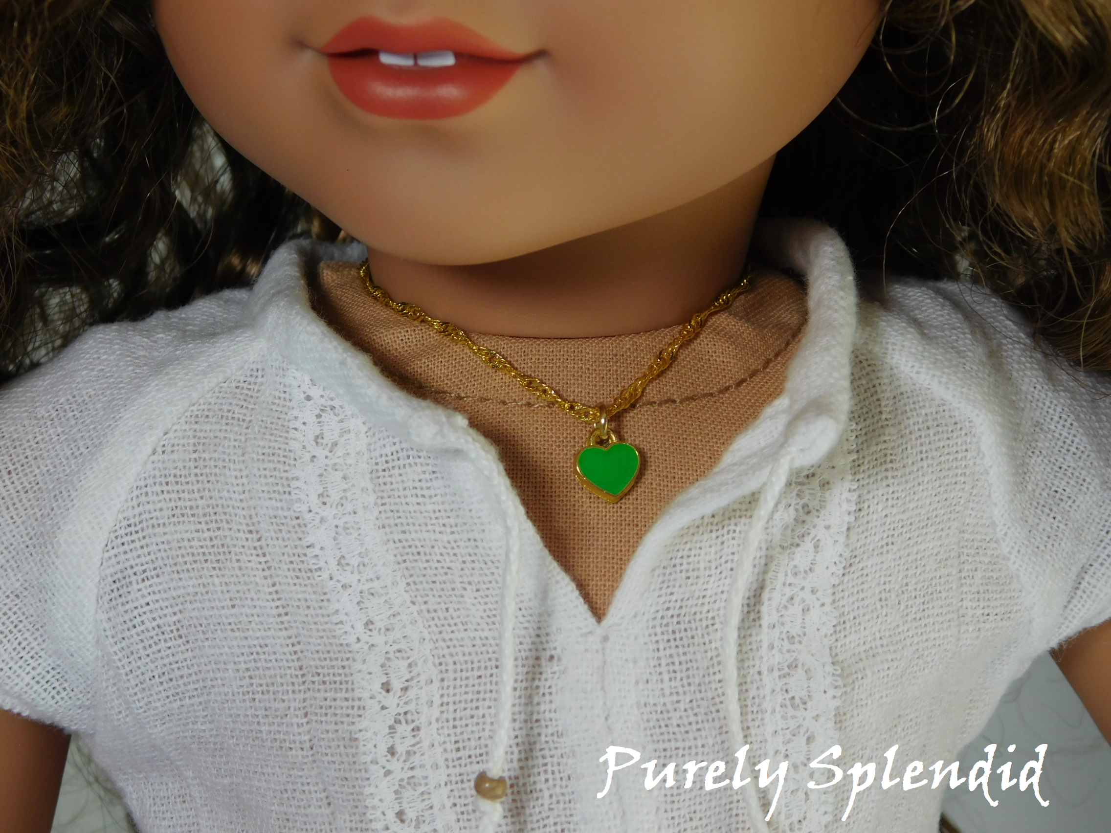 18 inch doll shown wearing a Green Mini Heart Choker necklace - small green heart on a twisted gold chain