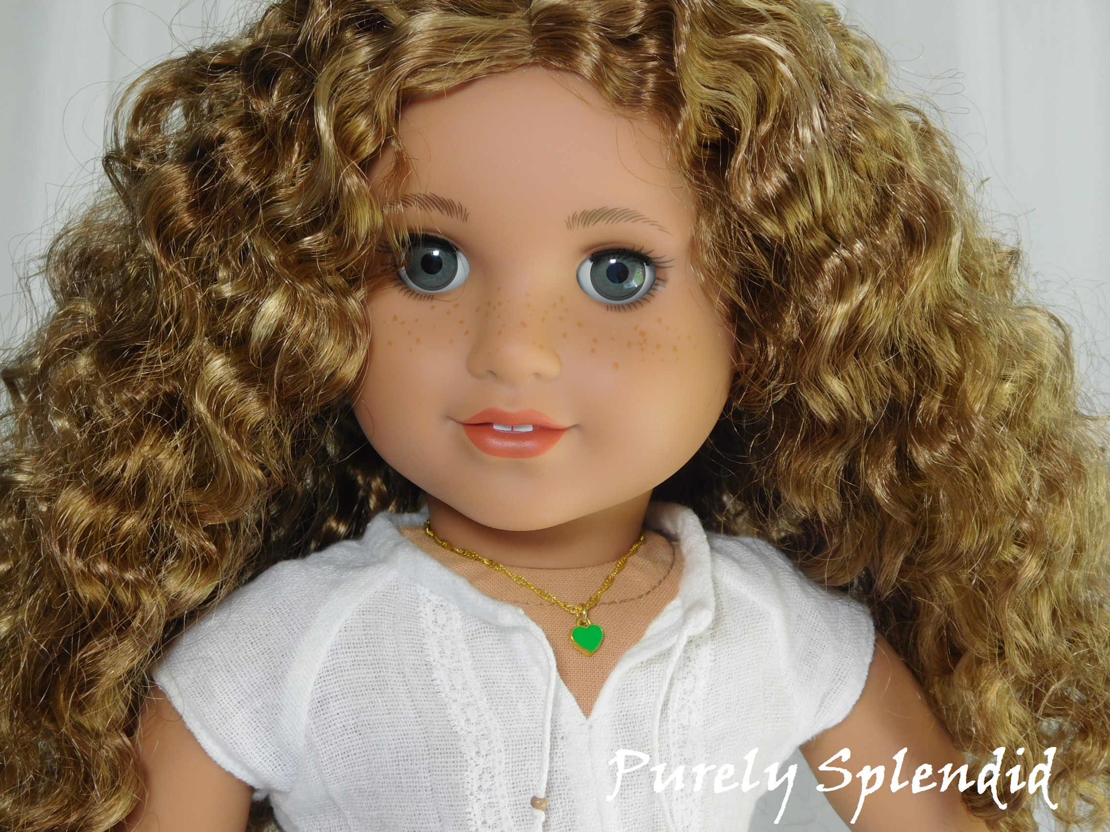 18 inch doll shown wearing a Green Mini Heart Choker necklace - small green heart on a twisted gold chain