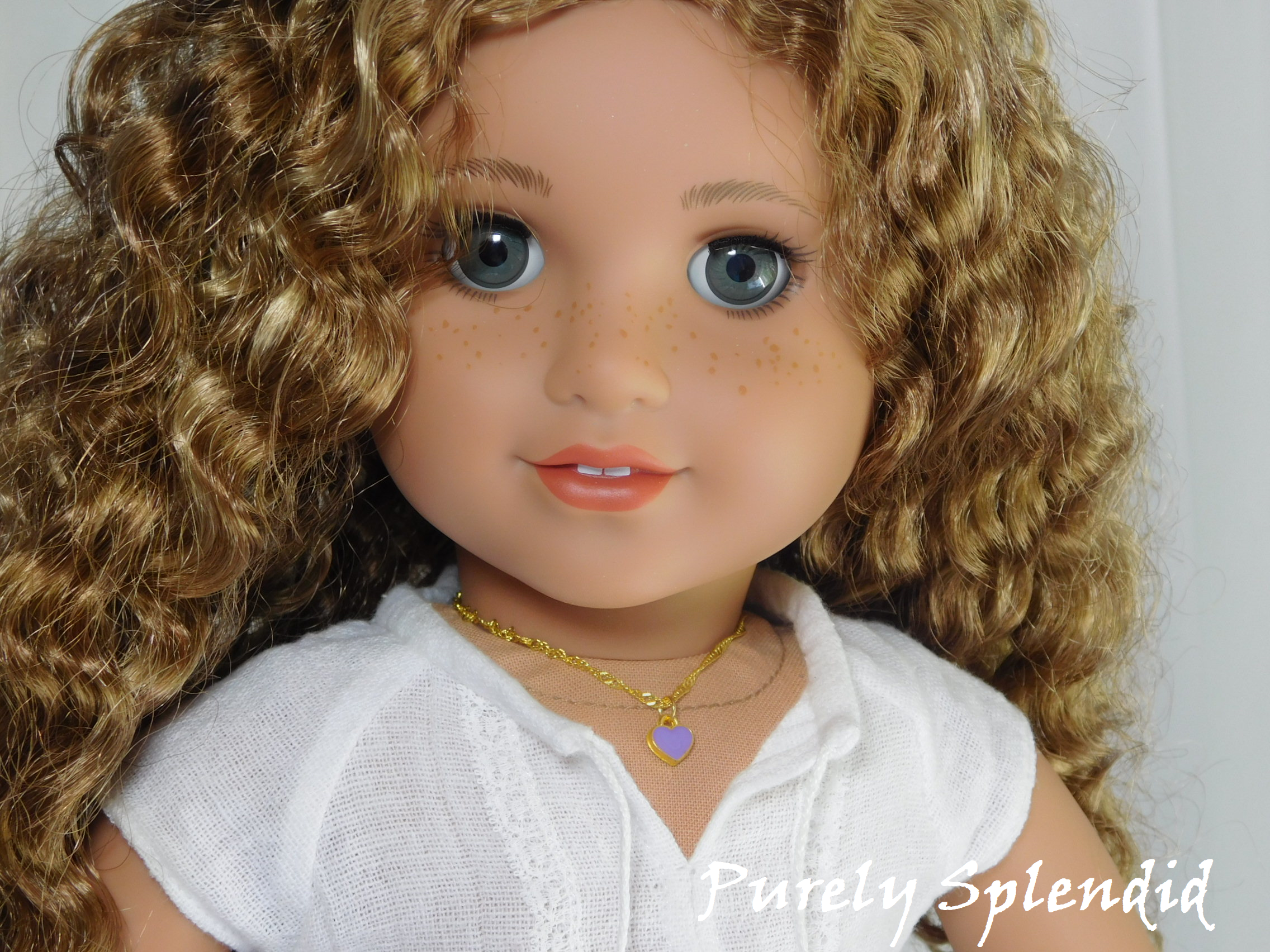 18 inch doll shown wearing a Lavender Mini Heart Choker necklace - small lavender heart on a twisted gold chain