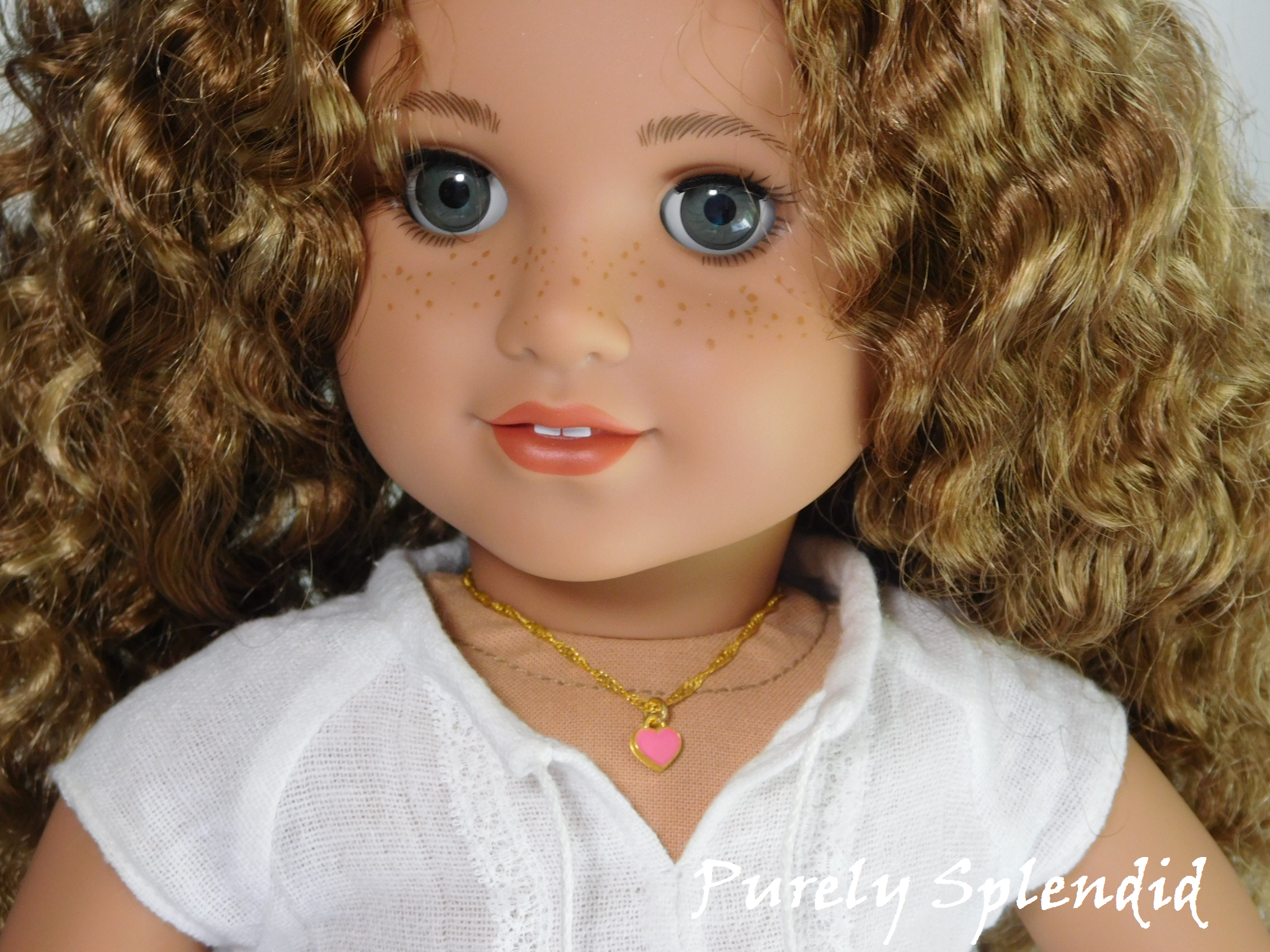 18 inch doll shown wearing a Pink Mini Heart Choker necklace - small pink heart on a twisted gold chain