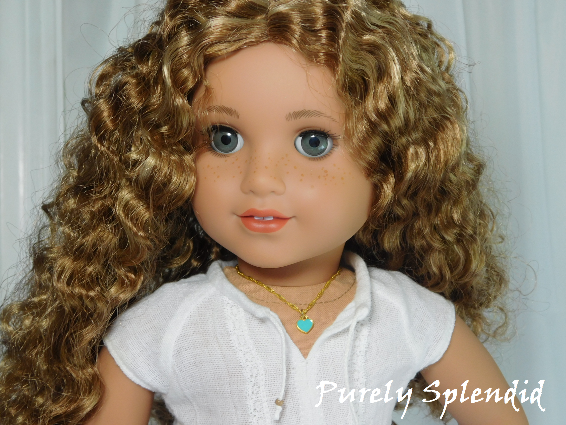 18 inch doll shown wearing a Teal Mini Heart Choker necklace - small teal heart on a twisted gold chain