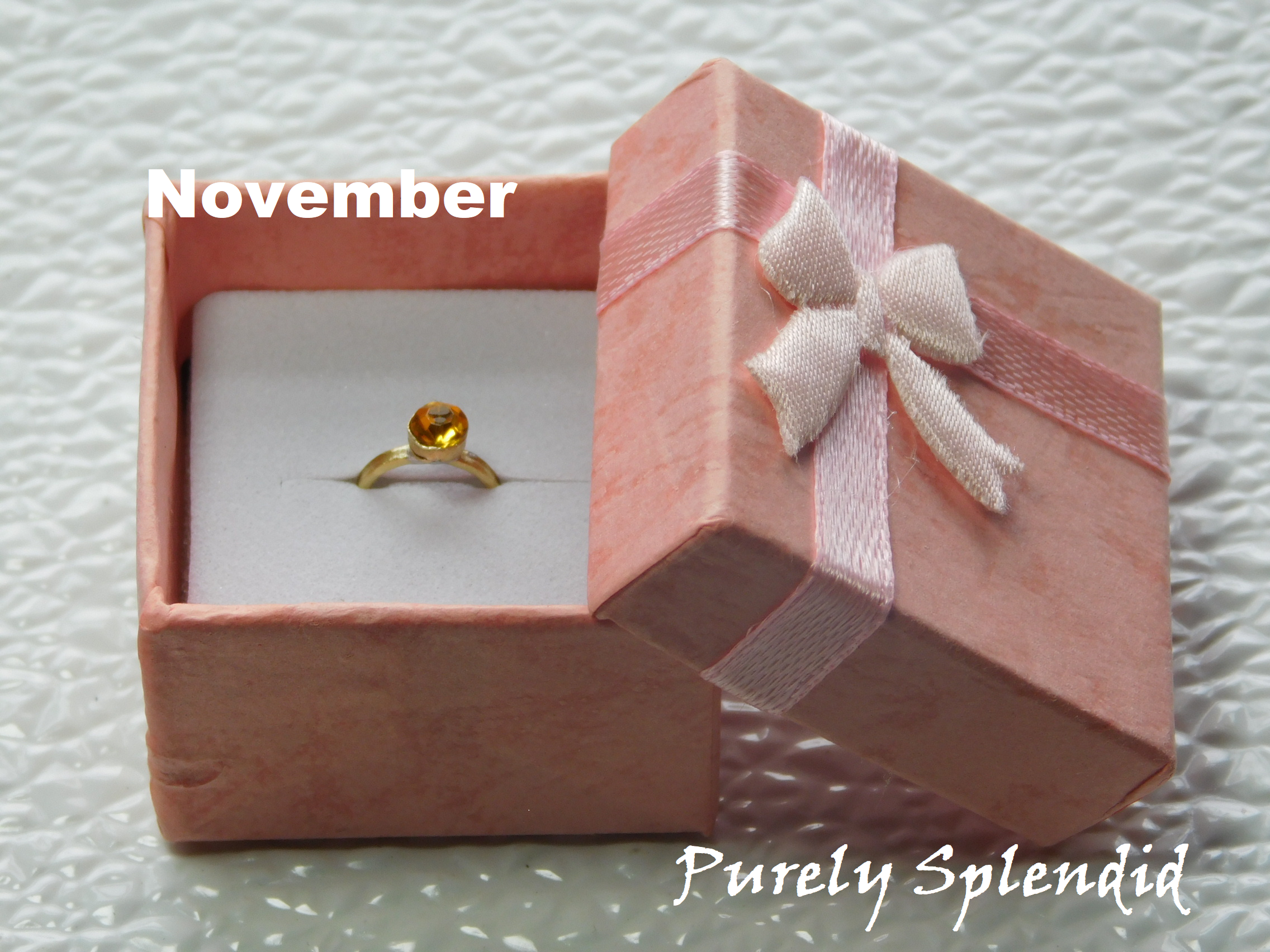 November Birthstone Ring for 18 inch dolls - topaz colored crystal on a gold band