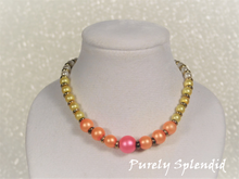Load image into Gallery viewer, Neon Pearl Necklace with one large center pink pearl surrounded by 3 medium orange pearls surrounded by 5 small yellow pearls as well as small white pearls. All are seperated wth a gold bead
