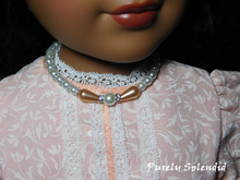 Load image into Gallery viewer, 18 inch doll wearing a Peaches n Pearl Necklace
