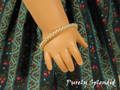 single row of white pearls stacking bracelet shown worn by an 18 inch doll