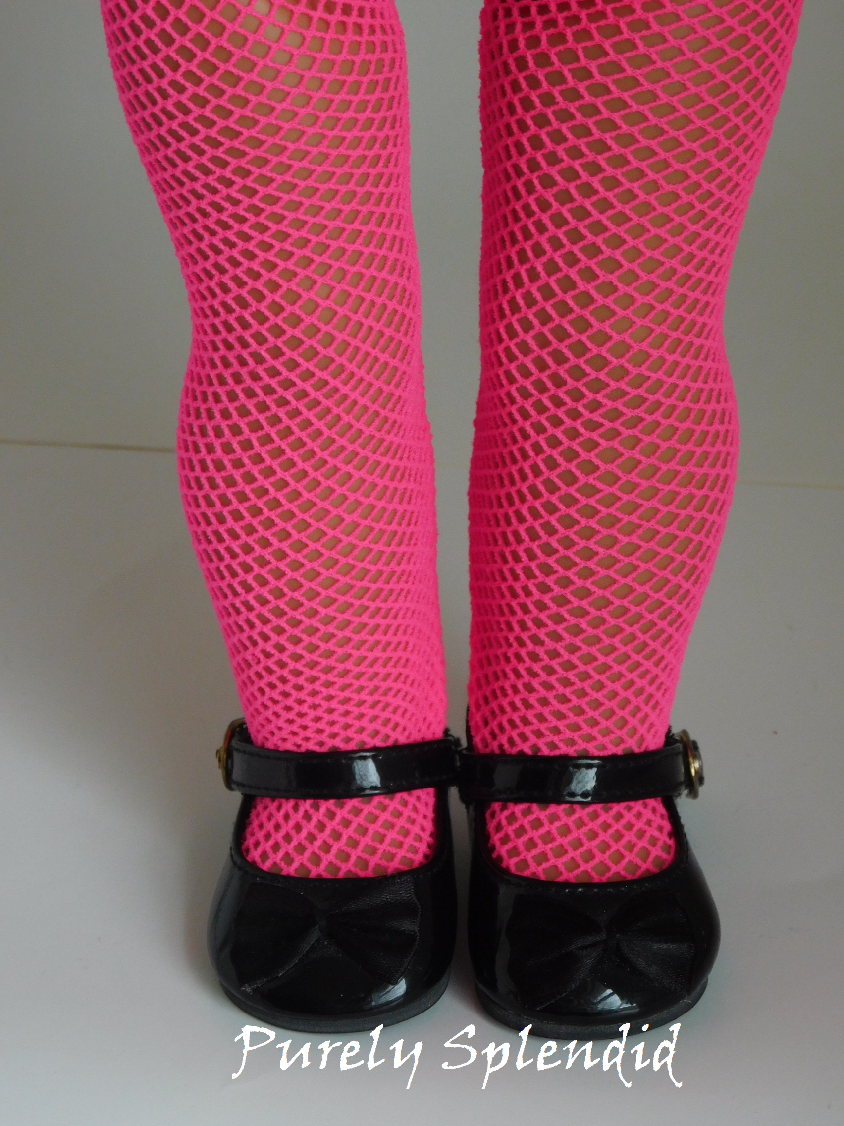 Pink Fishnet Tights shown on an 18 inch doll
