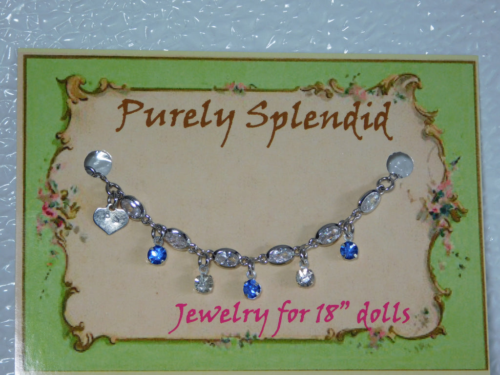 crystal bracelet with alternating light blue and clear crystals dangling 
