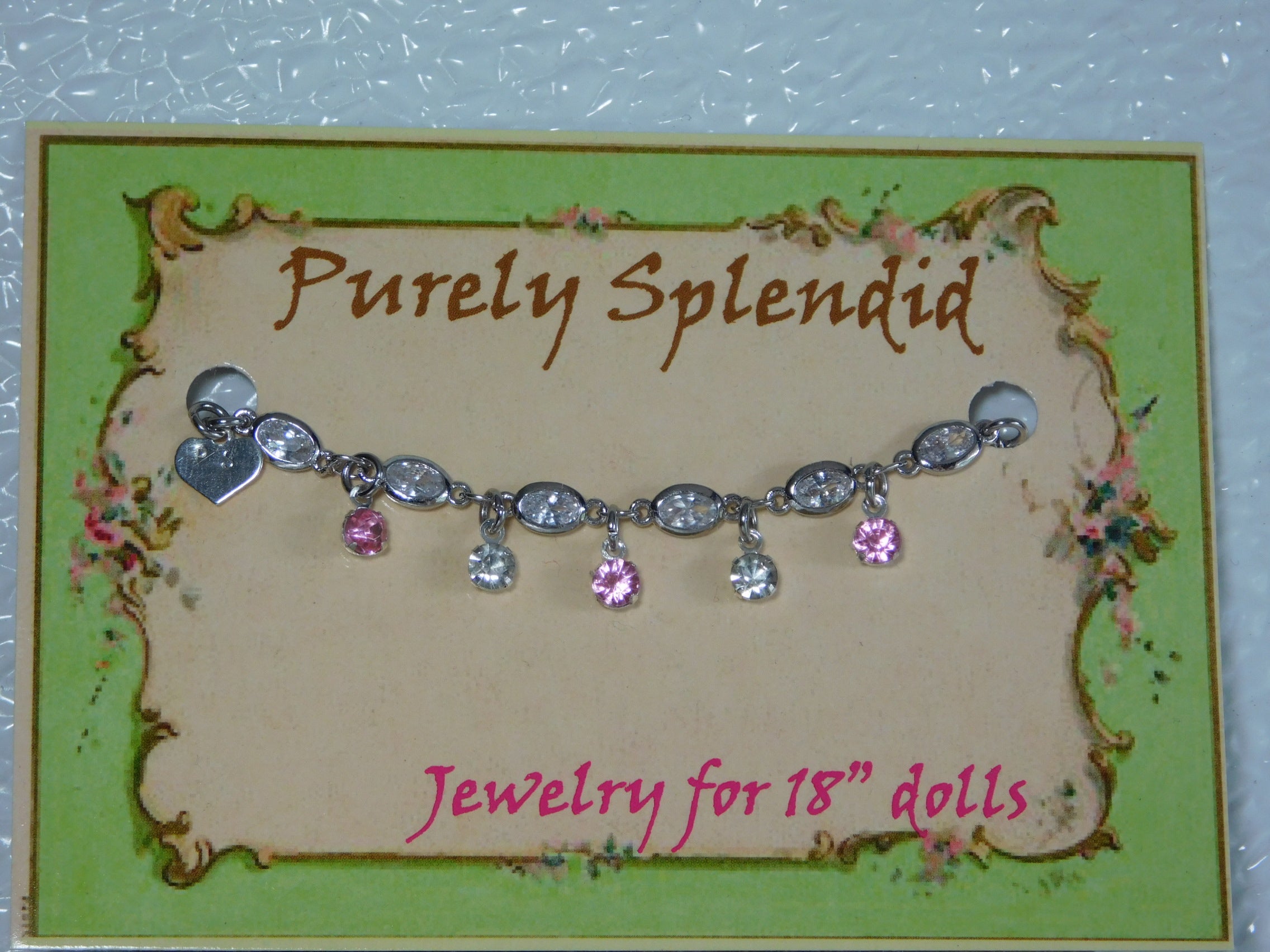 crystal bracelet with alternating light pink and clear crystals dangling from the bracelet