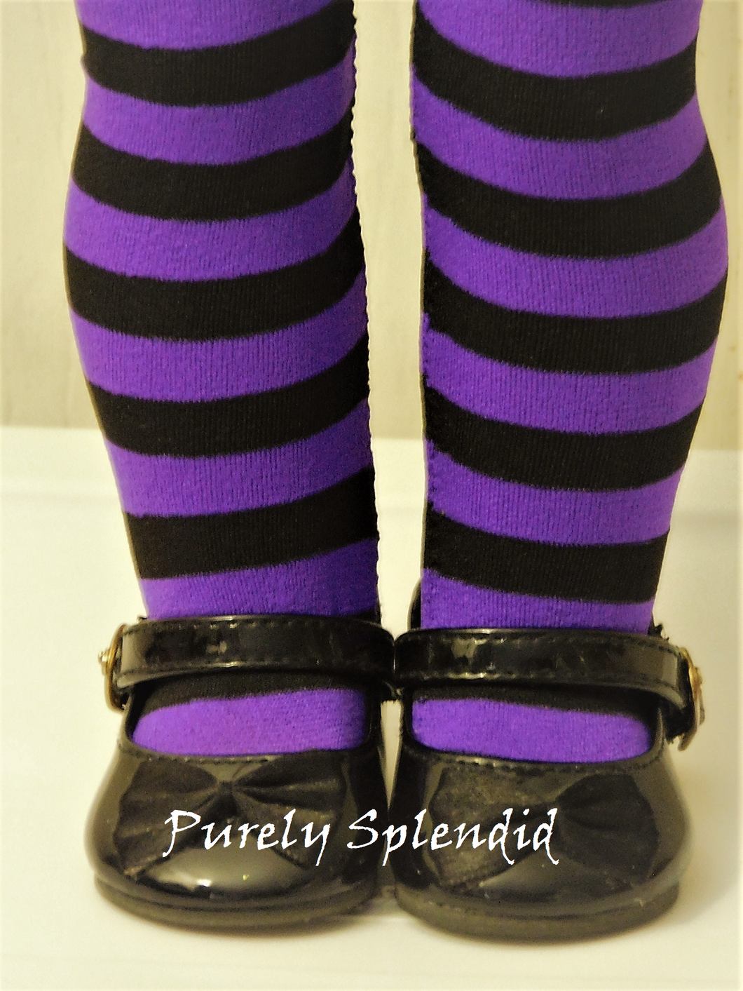 Purple and Black Striped Tights shown on an 18 inch doll