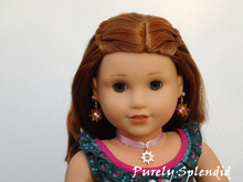 Load image into Gallery viewer, 18 inch doll shown wearing Rapunzel Earring Dangles featuring a 18KG plated sun with an large sparkling Aurora Borealis center crystal along with a pair of 2mm Aurora Borealis crystal studs and a matching choker necklace
