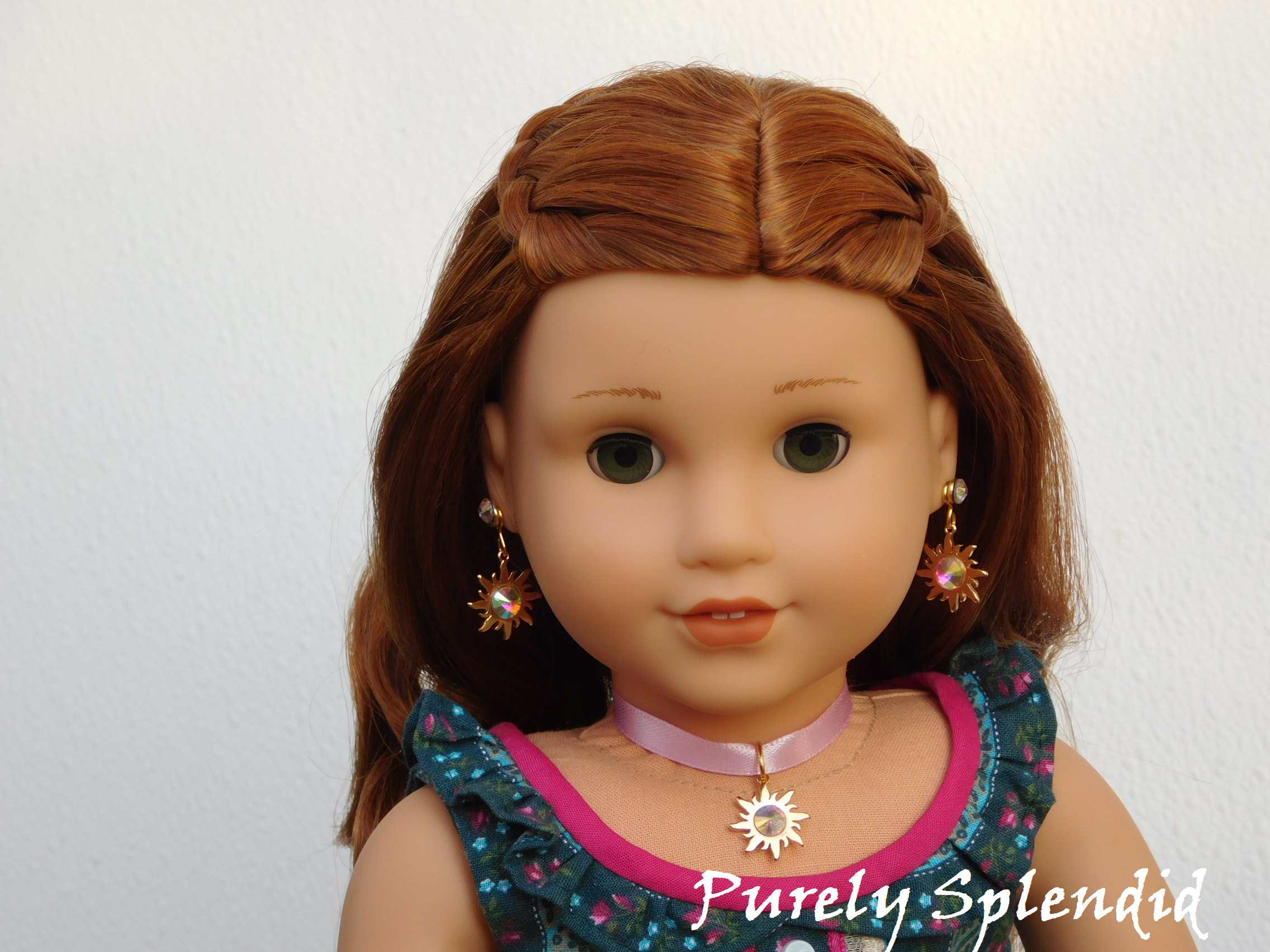 18 inch doll shown wearing Rapunzel Earring Dangles featuring an 18KG plated sun with a large sparkling Aurora Borealis center crystal along with a pair of 2mm Aurora Borealis crystal studs and a matching choker necklace