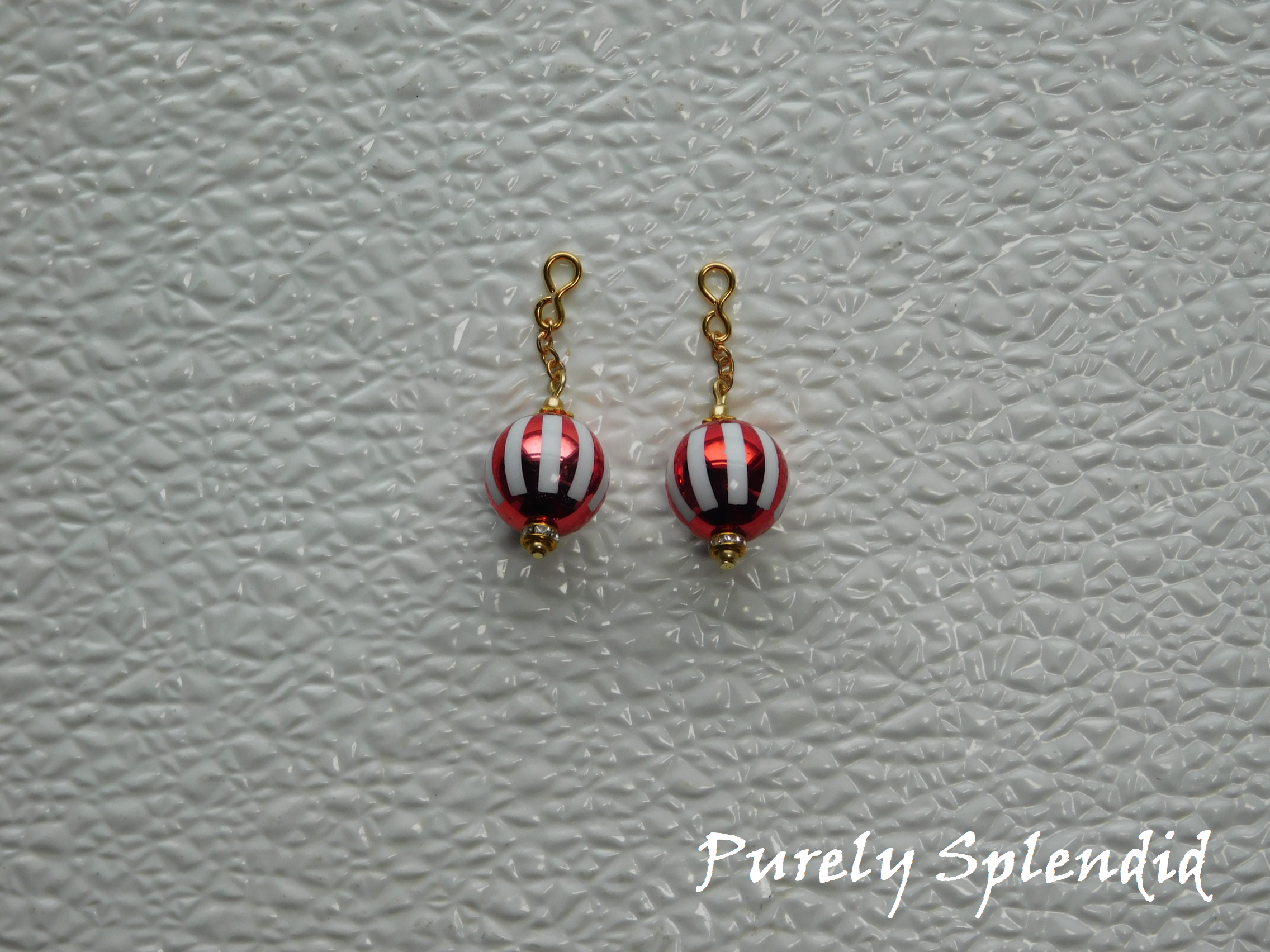 to use with 2mm stud earrings have a loop for the stud to fit through
