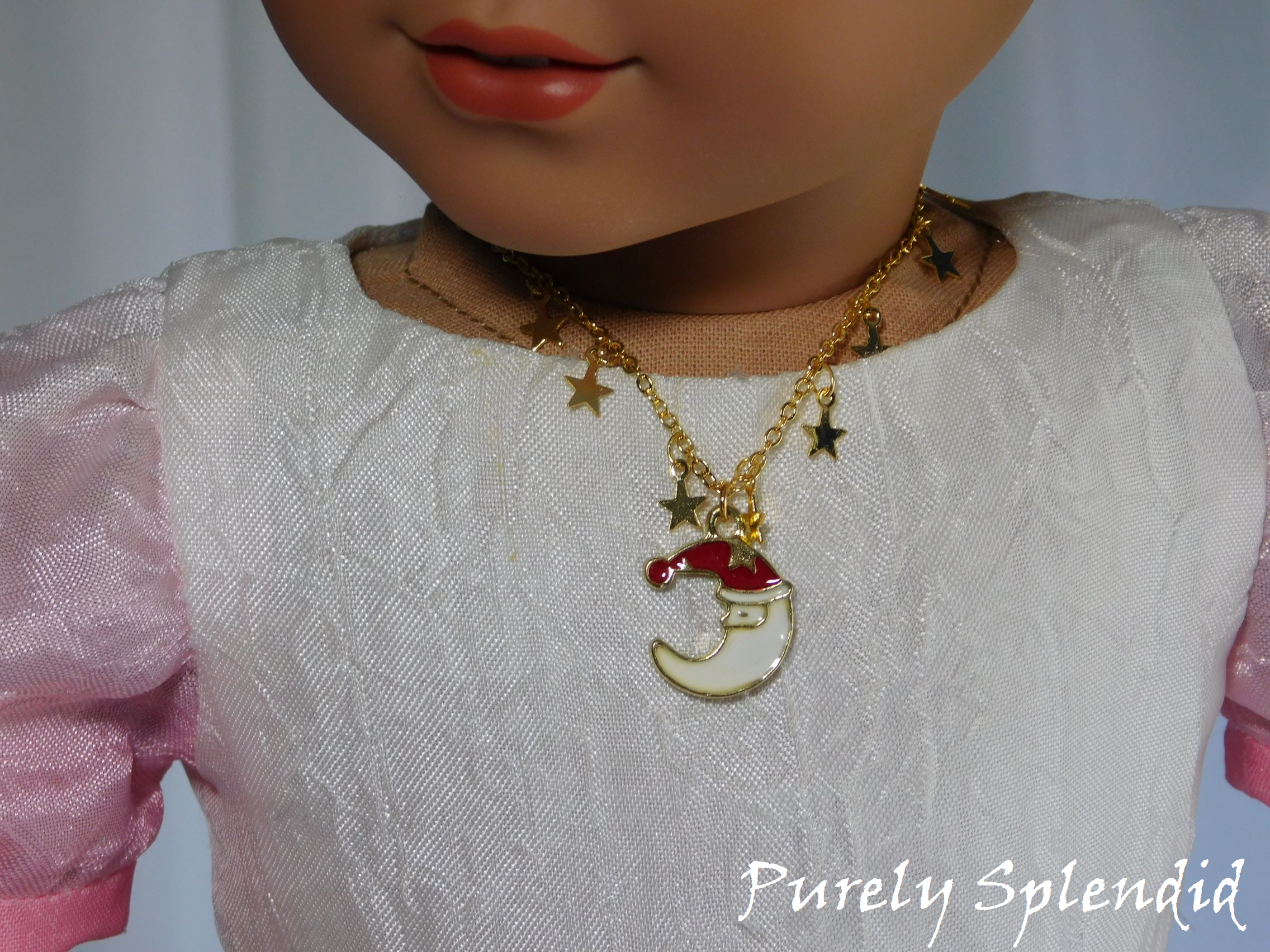 Santa Necklace worn by an 18 inch doll
