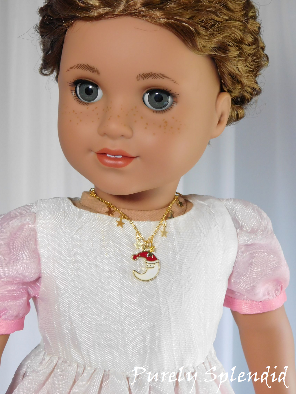 18 inch doll wearing a Santa Necklace 