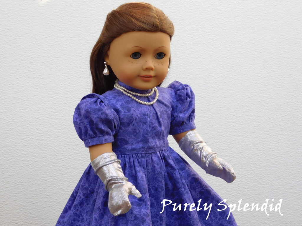 18 inch doll shown wearing a pair of Silver Shimmer Gloves