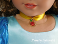 18 inch doll wearing a yellow ribbon choker with sparkling red apple