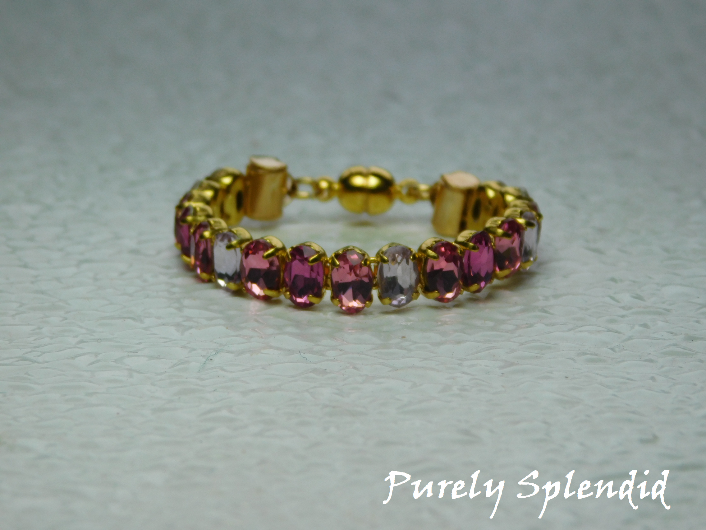Beautiful pink and lavender crystals make up this Sparkling Shades of Pink Bracelet for dolls