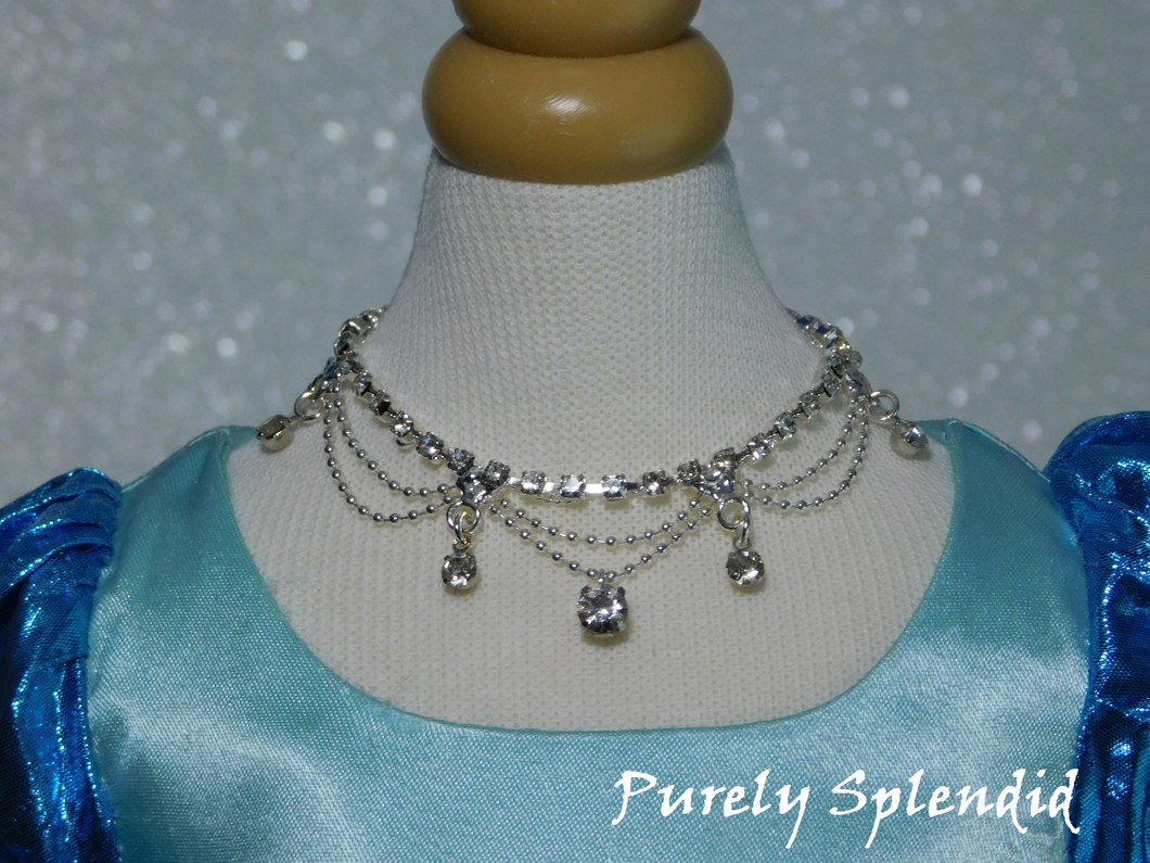 Sparkling rhinestone necklace with silver swoops and sparkling rhinestone dangles