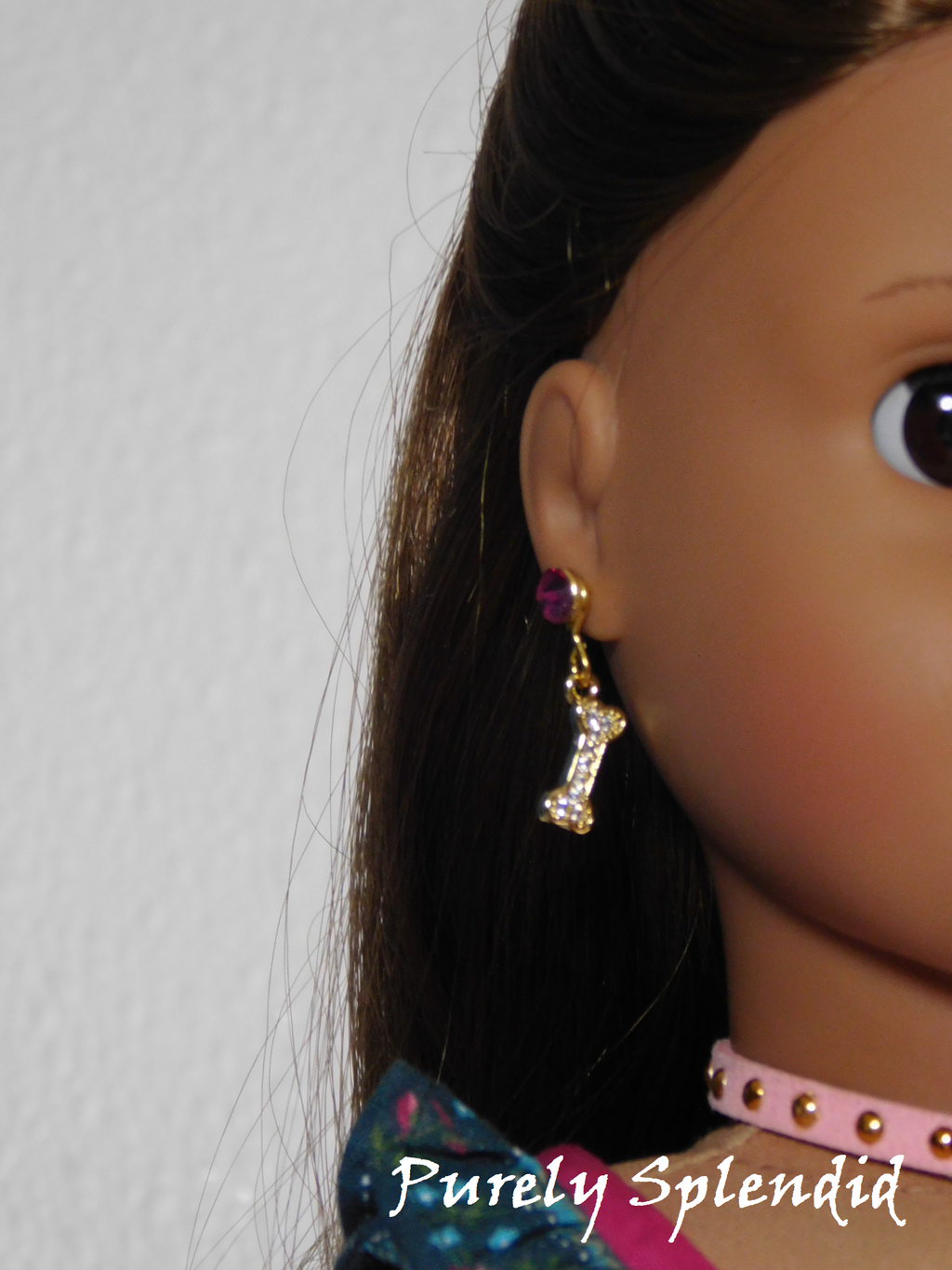 Sparkling Dog Bone Earrings worn by an 18 inch doll
