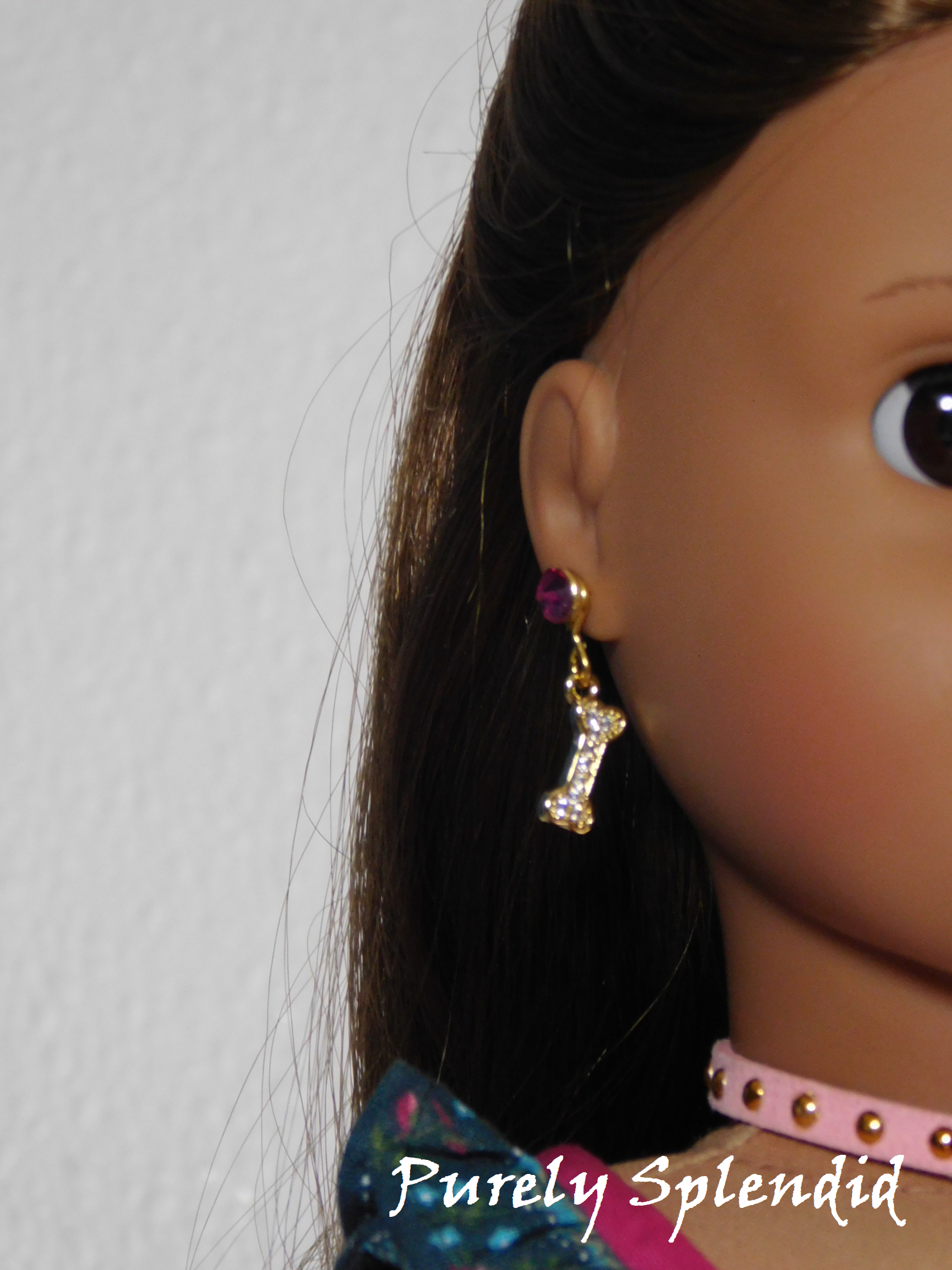 Sparkling Dog Bone Earrings worn by an 18 inch doll