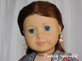 18 inch doll shown wearing a pair of Sparkling Gold Star Earrings - gold open stars with a large sparkling center stone