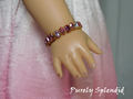 18 inch doll shown wearing a Sparkling Shades of Pink Bracelet