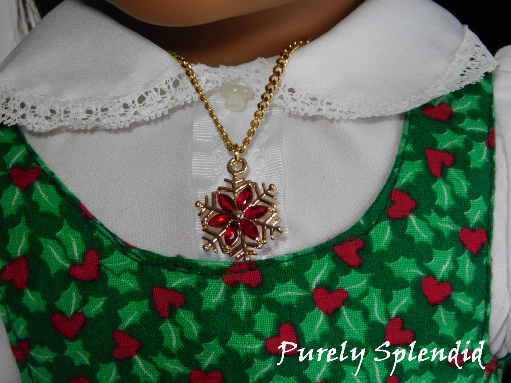 Gold snowflake with sparkling red flower center