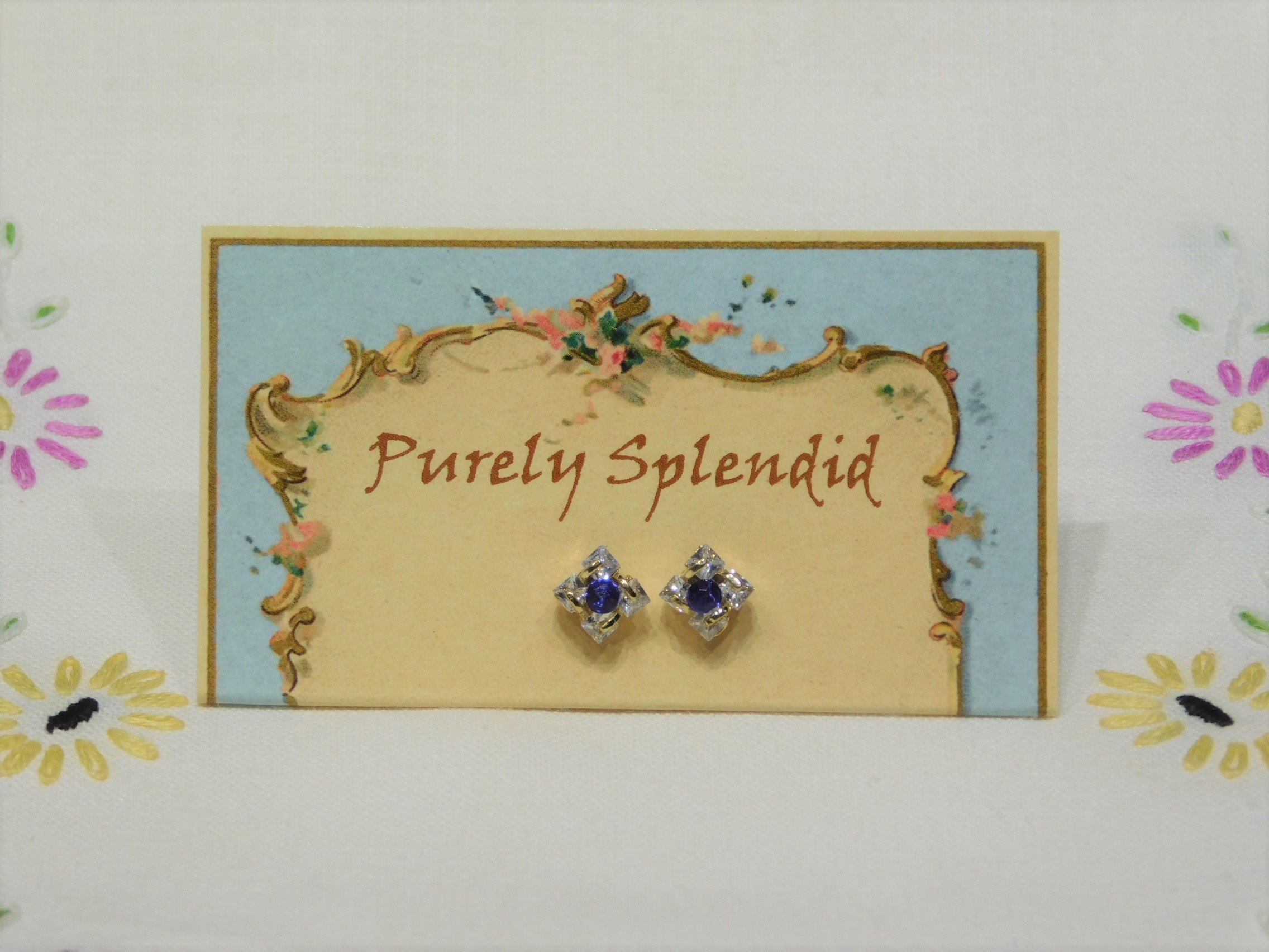 sparkling square studs with dark blue center crystals