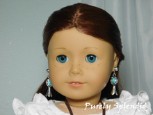 Load image into Gallery viewer, 18 inch doll shown wearing a pair of Squash Blossom Earrings featuring an oval turquoise colored stone as a part of the silver blossom
