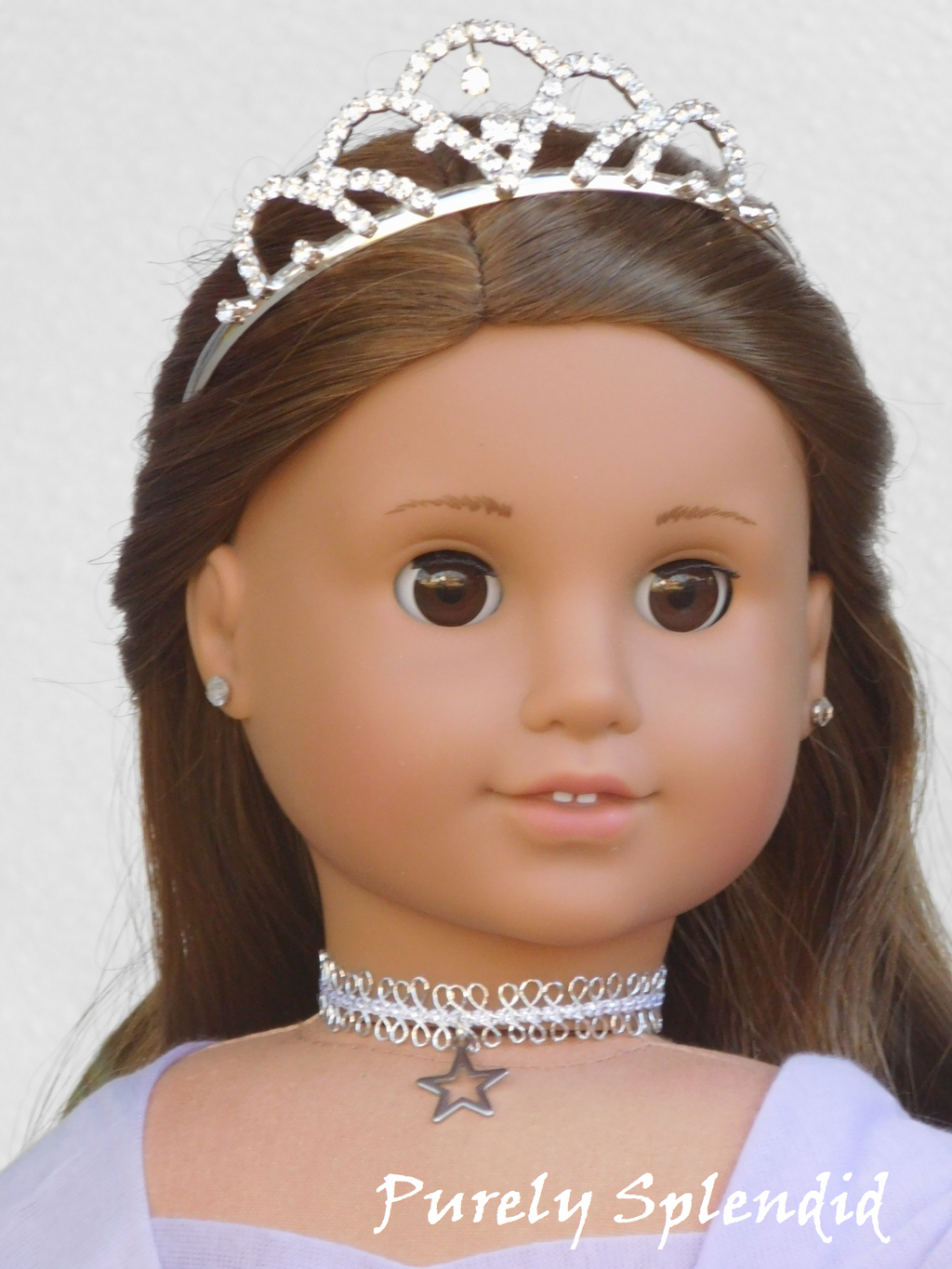 Sugar Plum Fairy wearing a silver metallic choker with silver open star charm