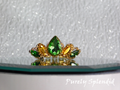 Peridot and gold colored crystals make up this pretty Tiana Crown for dolls