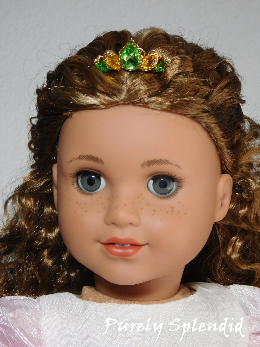 18 inch doll shown wearing a Peridot and gold crown