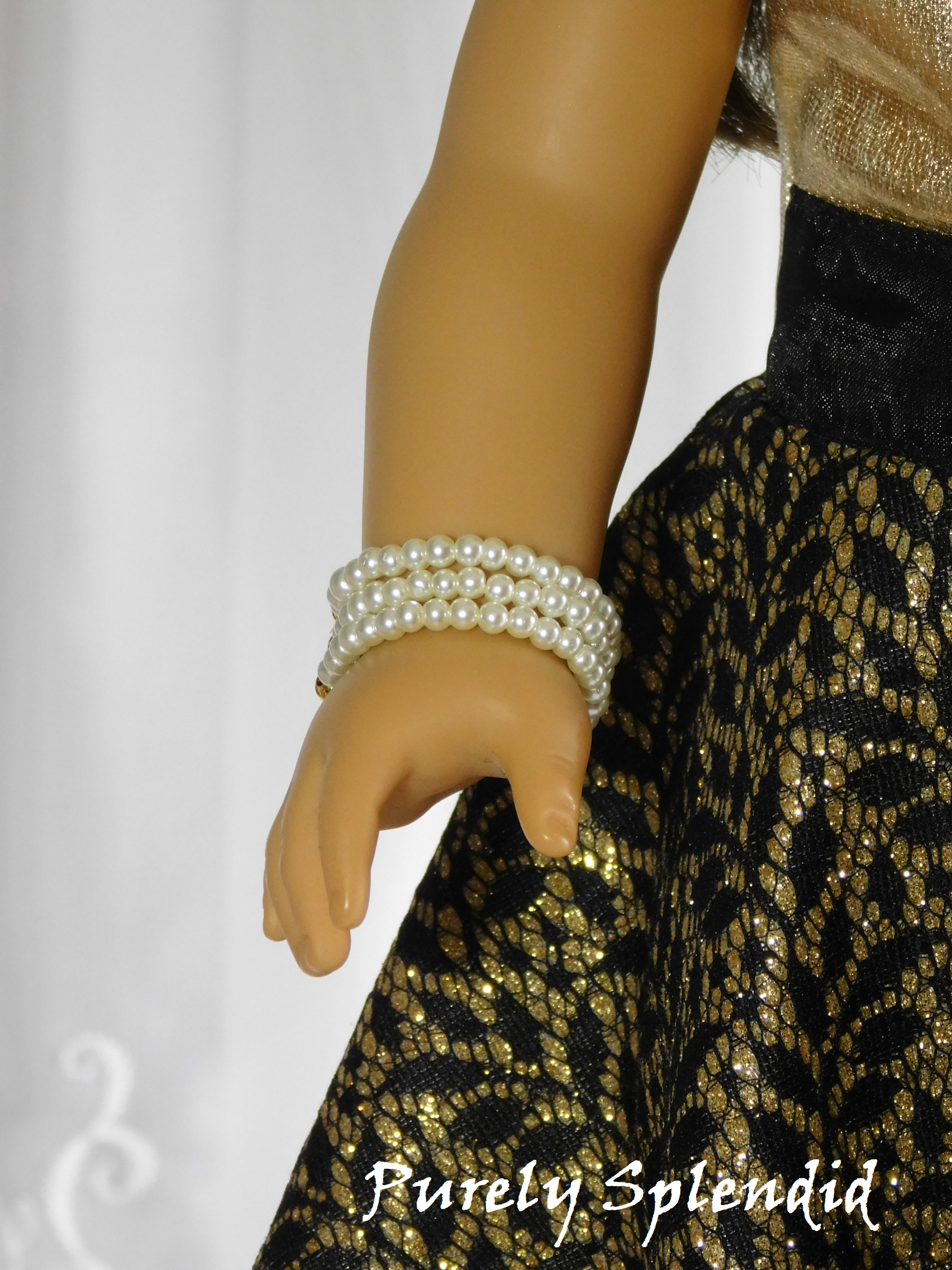 18 inch doll shown wearing a Triple Strand Pearl Bracelet