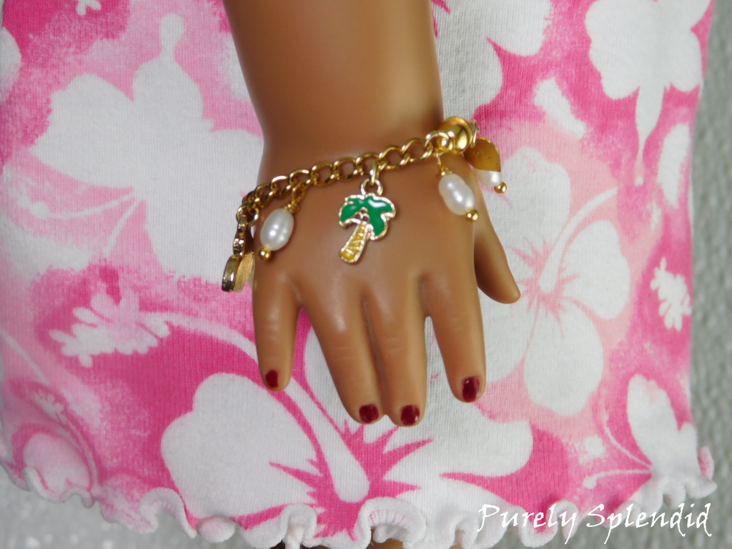 Tropical Charm Bracelet worn by an 18 inch doll featuring freshwater pearls and a palm tree charm