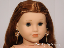 Load image into Gallery viewer, 18 inch doll shown wearing a pair of Wavy Circle Dangles and a pair of Small Gold Studs
