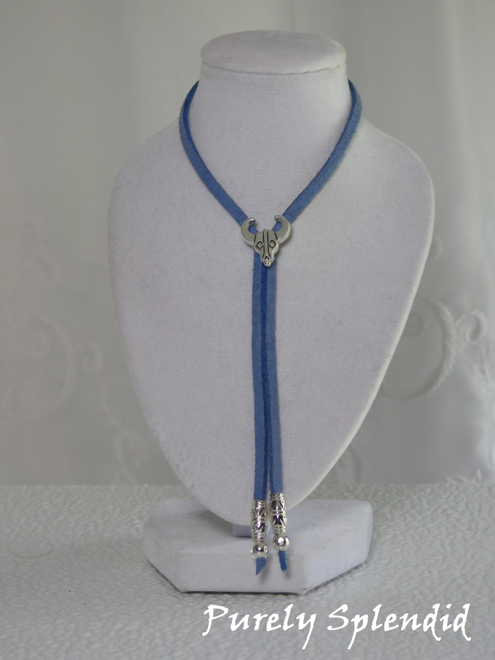 Western Bolo in blue with silver steer head slider and silver tipped ends